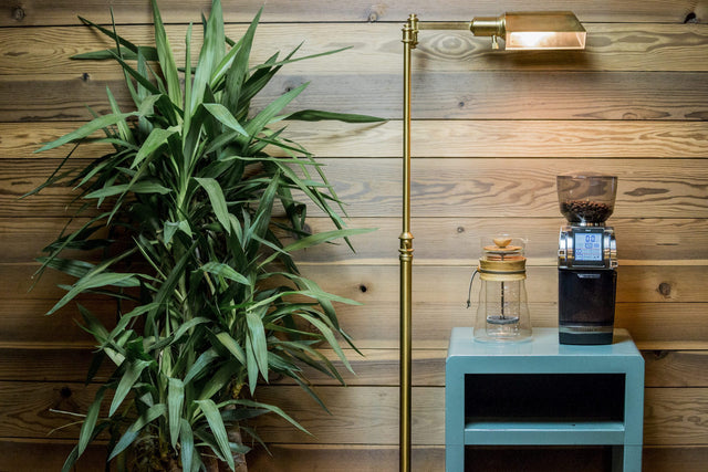 Baratza Forte BG Coffee Grinder on a table next to Hario french press, Clive Coffee - Lifestyle - Large