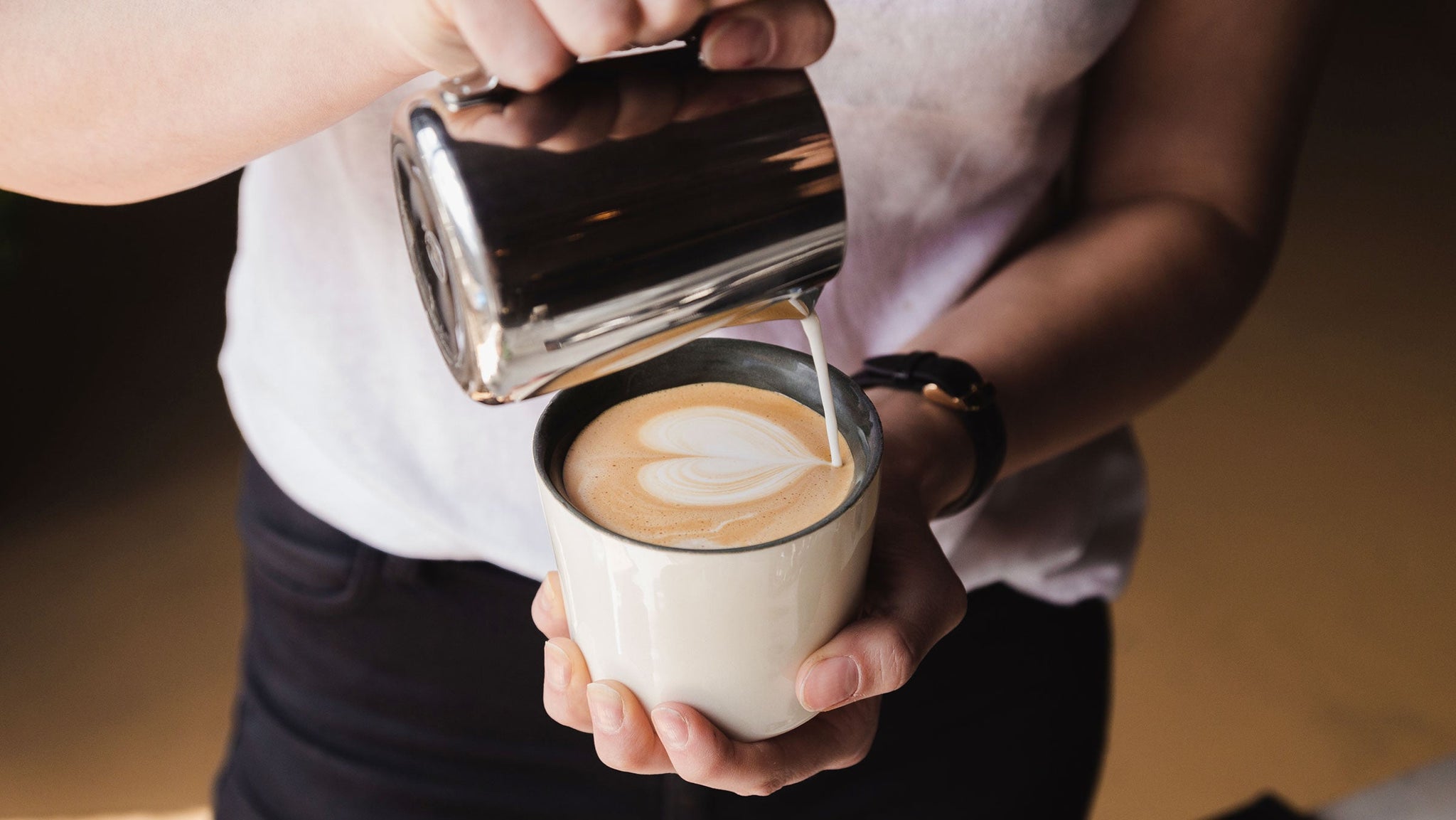 latte art pouring a heart clive coffee lifestyle