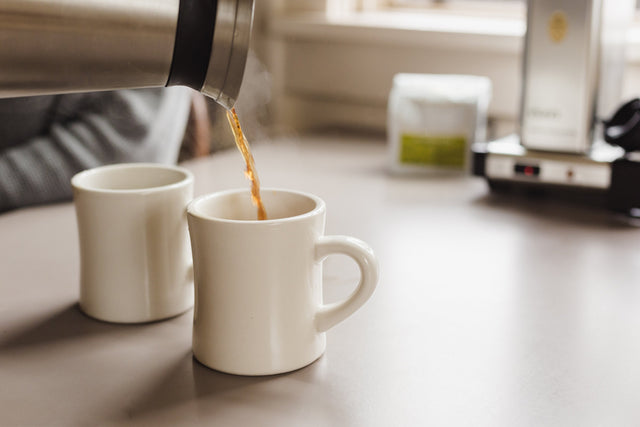 Pouring into mugs from the thermal carafe of a Technivorm Moccamaster KBGT-741, Clive Coffee - Lifestyle