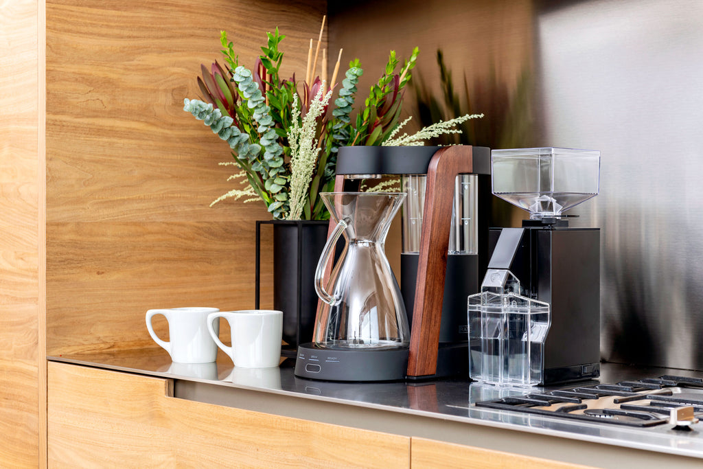 Ratio Eight coffee maker in dark cobalt with walnut accents, alongside a Eureka Mignon Filtro coffee grinder, Clive Coffee - Lifestyle