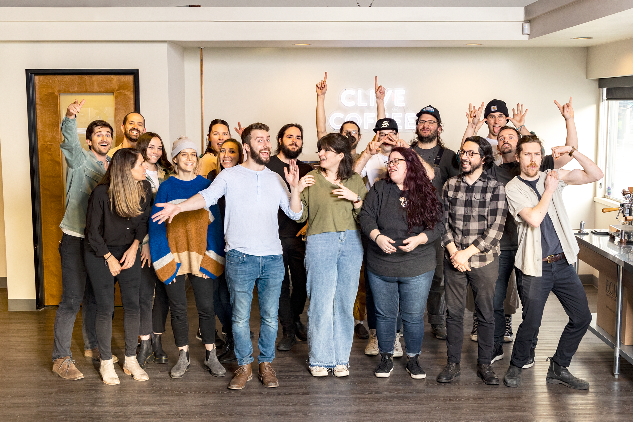 group picture of the staff of Clive Coffee in the Portland showroom